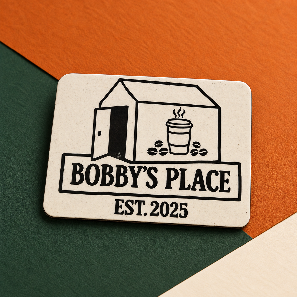 Bobby's Place fridge magnet on Bobby's Beans orange, green and cream background