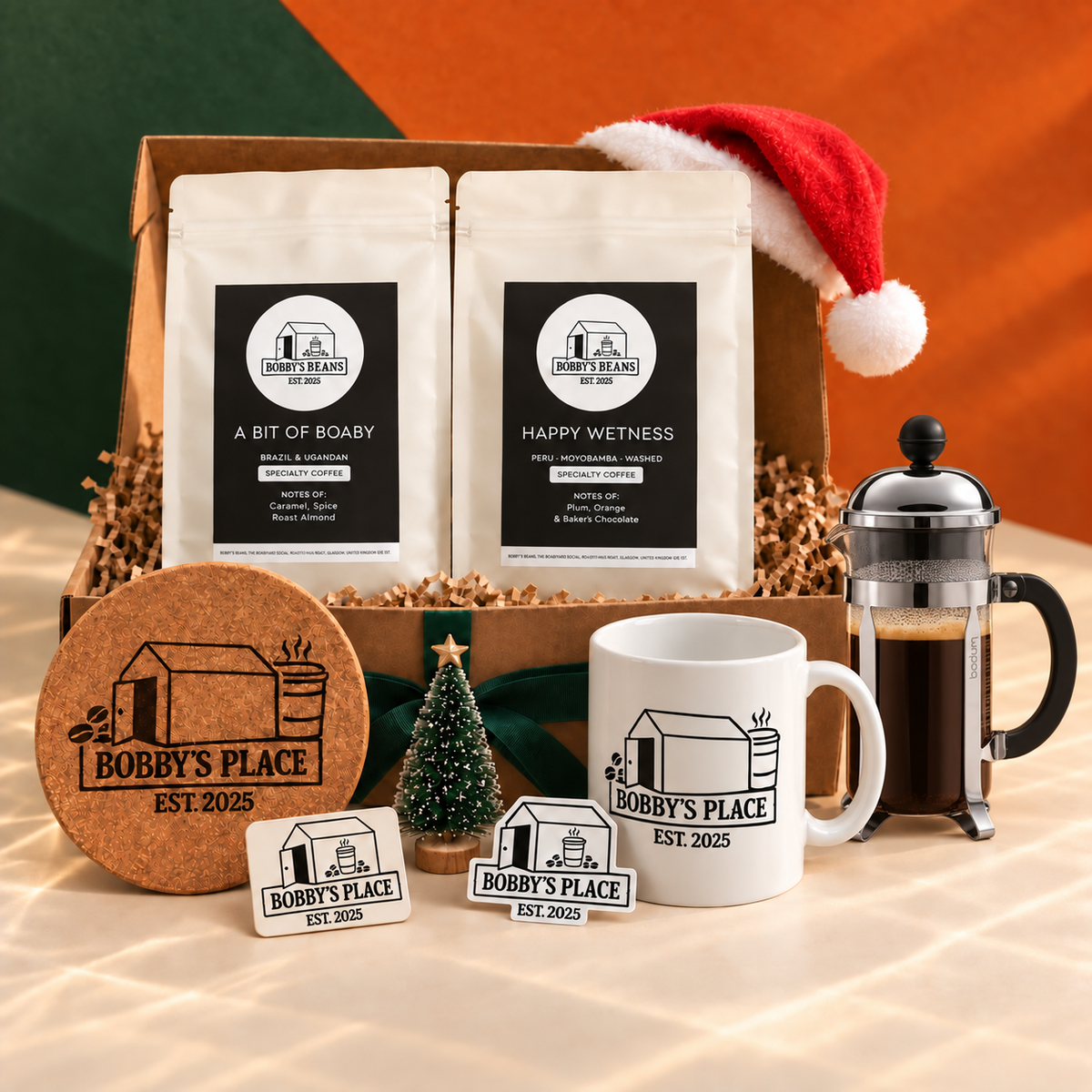 An Xmas Box Of Boaby with an optional Bodum Chambord 3 cup, glass and chrome and Bobby's Place sticker.